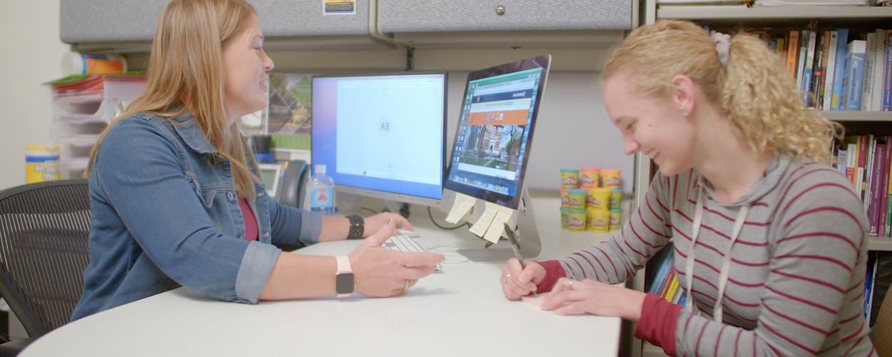 Advisor working with a student